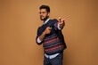 © Тарас Нагирняк - Indian stylish student in casual close, pointing his finger and hands