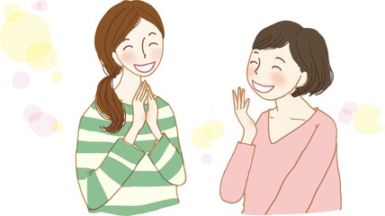 向き合って楽しく会話をする2人の女性。