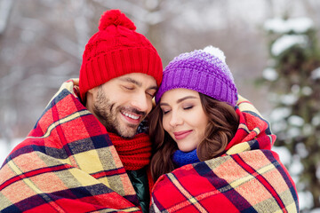 Sticker - Photo of sweet dreamy girlfriend boyfriend dressed vests covering plaid duvet smiling closed eyes walking snow outdoors forest