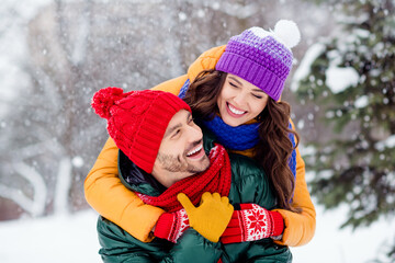 Wall Mural - Photo of charming shiny marriage couple wear windbreakers embracing looking eyes to eyes walking snowy weather smiling outside park