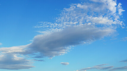 Wall Mural - large cloud angling against blue sky suitable for background or sky substitution