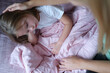 © H_Ko - Mother stroking head of little sad girl lying in bed
