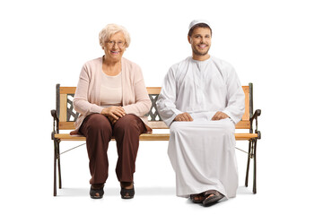 Poster - Young man in ethnic clothes and an elderly woman sitting on a bench and smiling