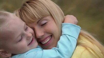 beautiful mother and her children outdoors. nature. beautiful mother and her child are playing toget