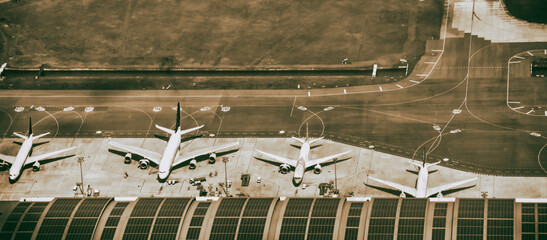 Sticker - Aerial view of multiple docked airplanes on the airport gate