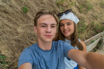 Group of cute teenage friends taking a selfie - Tourists taking a photograph on a day trip. happy friends taking selfie. Traveling concept background.