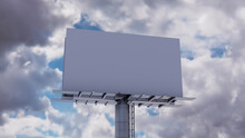Marketing Billboard. Empty Large Format Sign Against A Cloudy Afternoon Sky. Mockup Template.