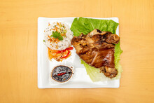 Filipino Recipe For Crispy Pata, Roasted Pork Knuckle With Crispy Skin With Sauce, White Rice And Grated Vegetables