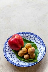 Wall Mural - Mixed fruit plate on white stone table