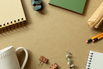 Various office supplies on brown background. workspace. flat lay, top view, copy space