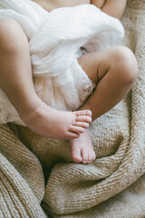 Wall Mural - Newborn Baby Swaddled in Linen on Neutral Background 