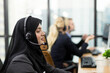 Team of diversity call center or operator at work. Muslim Asian woman customer support operator with headset. Muslim female working with headset in office. Contact center and customer service concept