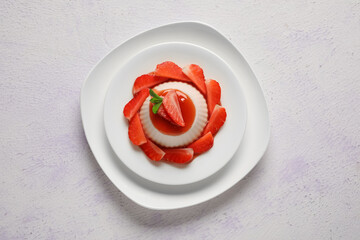 Wall Mural - Plate with delicious strawberry panna cotta on light background