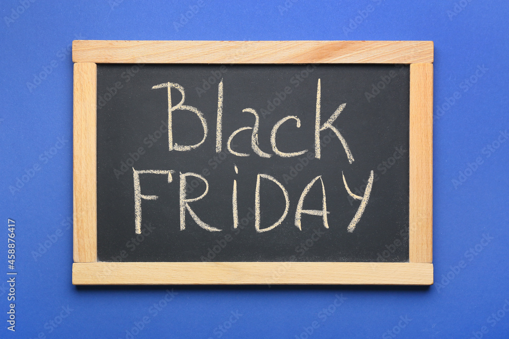 Chalkboard with text BLACK FRIDAY on color background