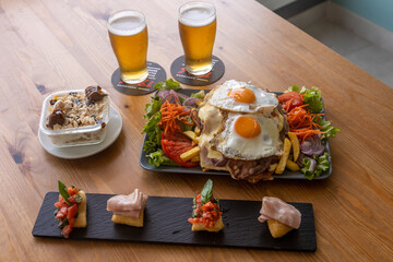 Wall Mural - Closeup shot of tasty classic Korean dish served in a restaurant with glasses of beers