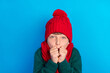 © deagreez - Photo portrait little boy wearing red headwear scarf trembling on frost isolated bright blue color background
