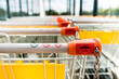 Shopping carts of a supermarket in a row, close up