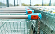 Shopping carts of a supermarket in a row, close up