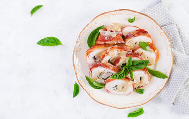 Wall Mural - Baked chicken rolls with basil and cheese on  plate. Healthy lunch. Keto diet.Top view, above