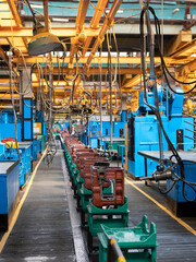 Transmission gearbox final assembly line at the tractor factory. Assembling shop interior. Tractor machinery components