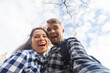 © satura_ - Happy couple making selfie photo in front of the famous Sagrada Familia catholic cathedral. Travel in Barcelona