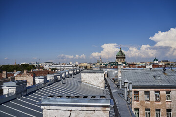 view from the rooftops to the Kazan Cathedral. European city roofs. view of the city from the roof. saint petersburg roofs. tourist trend. visiting card of the city.