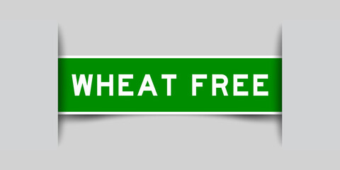 Poster - Inserted green color label sticker with word wheat free on gray background