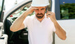 © Louis-Photo - Man engineer builder wearing a white hard hat, shirt in front of his pickup using cellphone and seem to be unhappy about something