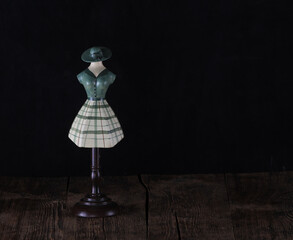 Poster - antique wooden mannequin on black background