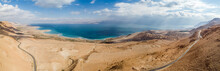 Panoramic Aerial View Of The Surrounding Desert Area Above The Dead Sea, Blue Water And Clear Blue Sky, Dead Sea, Negev, Israel.