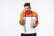 Angry tensed sportsman yelling at someone called in middle workout, training session, arguing on phone, hold smartphone near ear, shaking hand in dismay and anger, grimacing, jump rope around neck