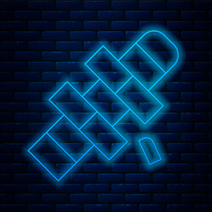 Wall Mural - Glowing neon line Hopscotch icon isolated on brick wall background. Children asphalt coating drawing. Vector