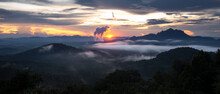 Aerial View Beautiful Mist After The Rain On The Mountain High Voltage Pole And Steam From A Coal Power Plant At Sunset, Pang Puey, Mae Moh, Lampang, Thailand. Panorama, Long Exposure.