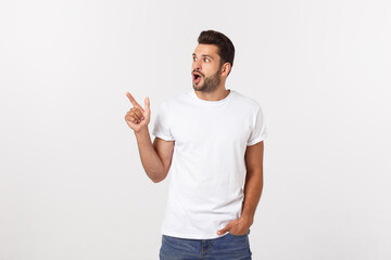 Wall Mural - Amazed smart man pointing up at copy space over white background.