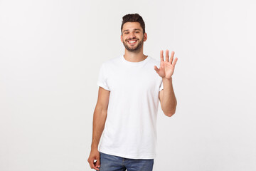 Wall Mural - Charming handsome. Handsome young man in casual wear while standing isolated on white background