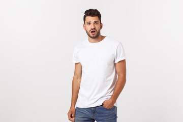 Wall Mural - Charming handsome. Handsome young man in casual wear while standing isolated on white background