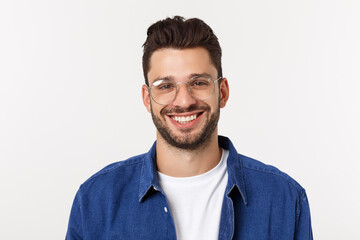 Wall Mural - Portrait of the young happy smiling handsome man isolated on a white background