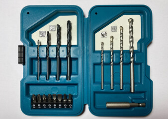 A set of bits and drills for wood, metal and brick in a beautiful box