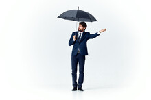 Man In A Suit Holding An Umbrella Over His Head Rain Protection Professional