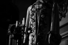 Shallow Depth Of Field (selective Focus) Image With An Actor Costume In The Dramatic Light Of The Stage.