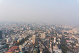 Fototapeta Nowy Jork - Landscape of the top view Bangkok metropolis Thailand with the dirty clouds air pollution problem. full of tower and buildings in business area