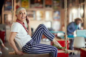 Wall Mural - Stylish elderly woman on a break