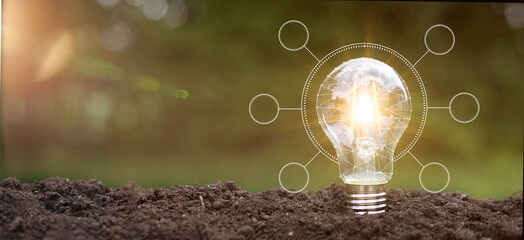 Green energy innovation light bulb with future industry of power generation icon graphic interface. Concept of sustainability development by alternative