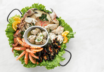 Wall Mural - mixed fresh seafood gourmet platter on spanish restaurant table