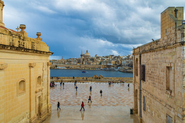 The parade ground at Fort Manoel a 18th century star fort built by the Order of Saint John. In the background is Marsamxett Harbour and the City of Valletta.