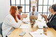 © Krakenimages.com - Group of business workers smiling and clapping to partner at the office.