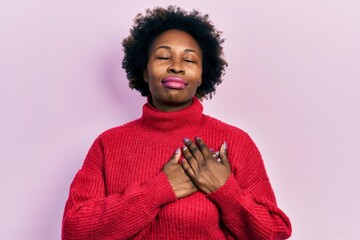 Wall Mural - Young african american woman wearing casual clothes smiling with hands on chest, eyes closed with grateful gesture on face. health concept.