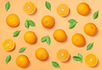 Fruit pattern arranged of oranges and orange leaves on yellow background. Lay out background.