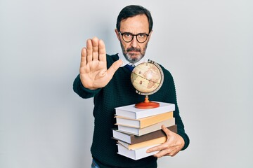 Poster - Middle age hispanic man graduated on geography with open hand doing stop sign with serious and confident expression, defense gesture