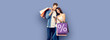 © vgstudio - Holiday sales actions, rebates, discounts, store retail, trade, consumer concept image - happy couple with shopping bags, looking at cell phone, standing close to each other. % sign